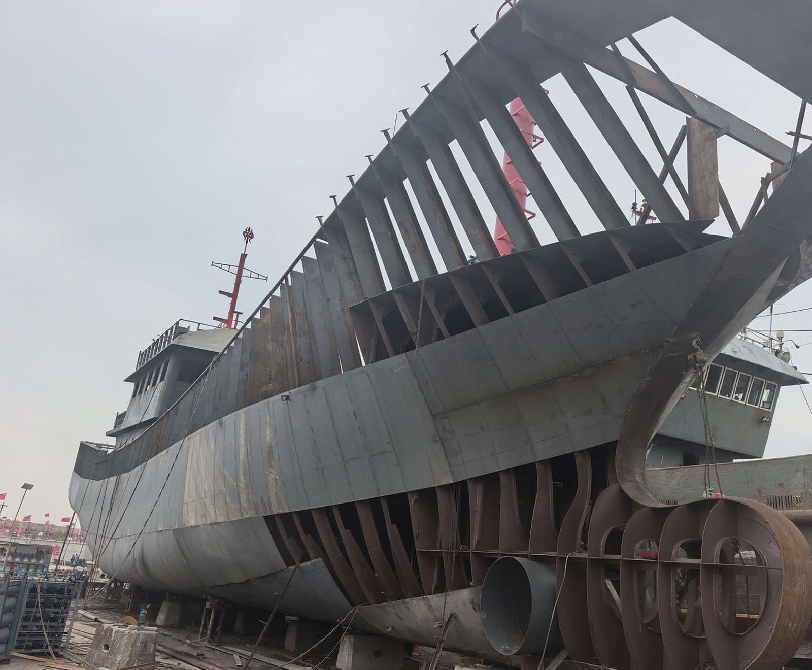 Steel fishing vessel under construction at the BLH Ship yard, frames and shell plating in place on the slipway